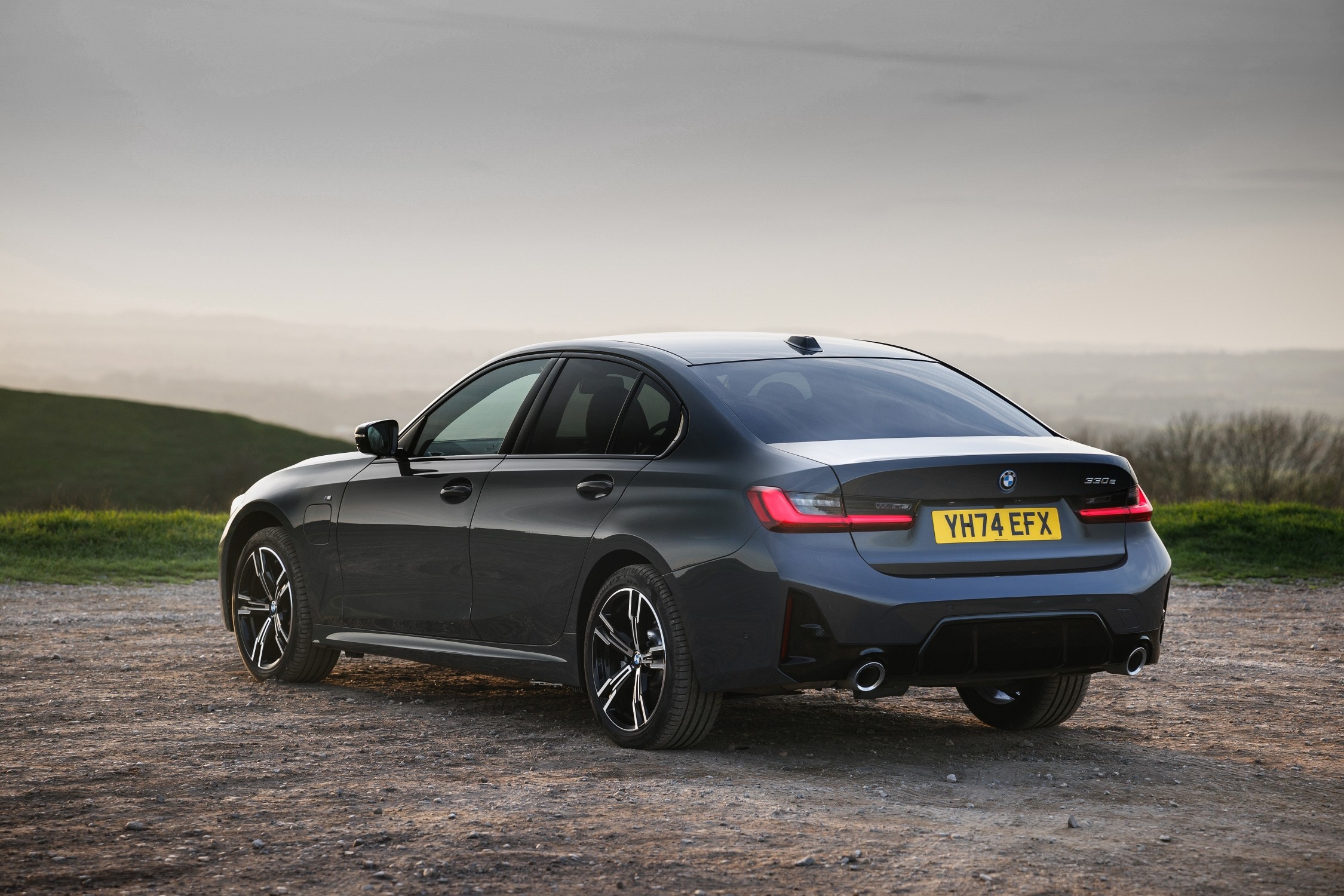 Rear three-quarter view of a blue BMW 3 Series Saloon