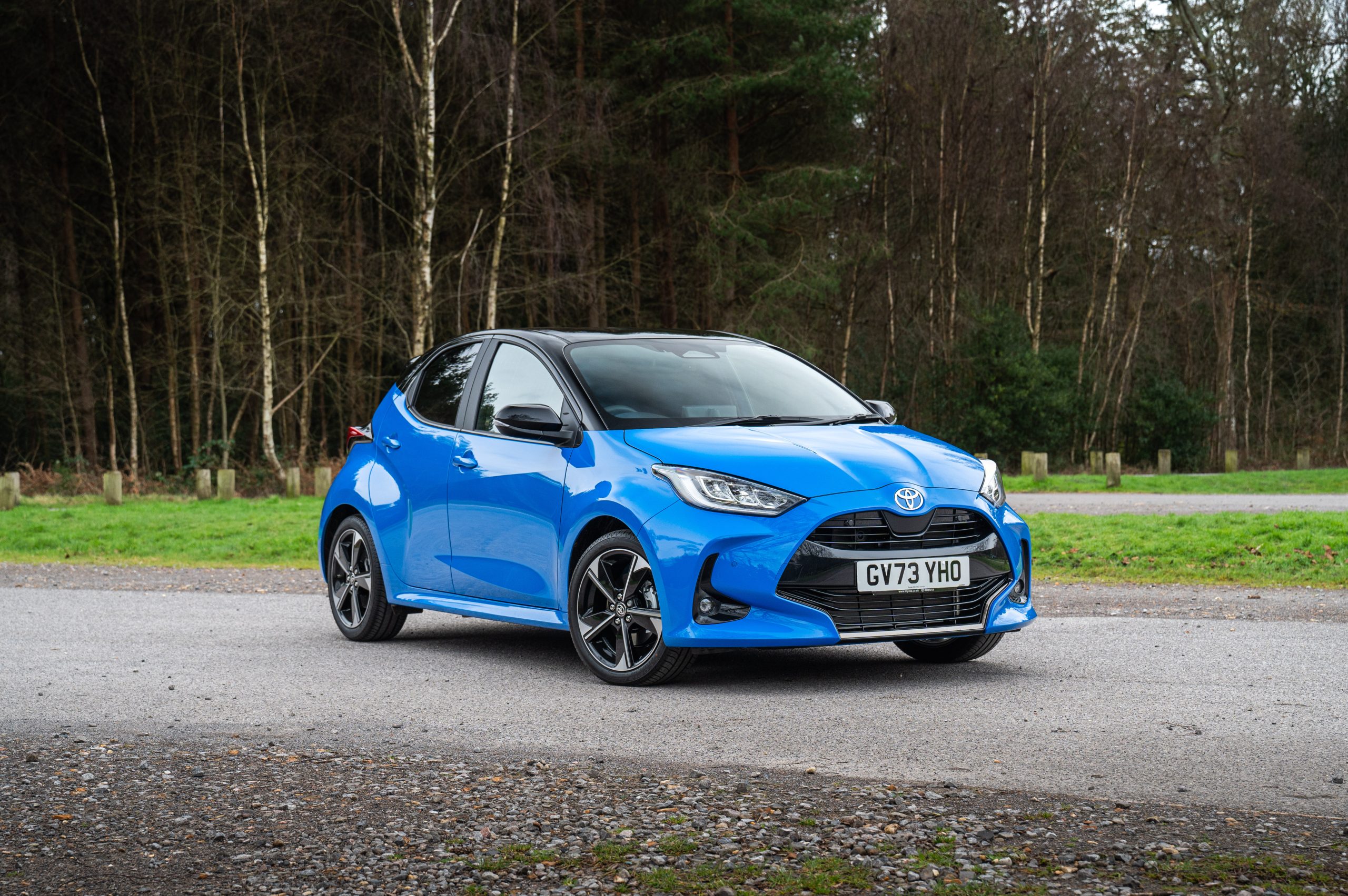Blue Toyota Yaris Premiere photographed on a road